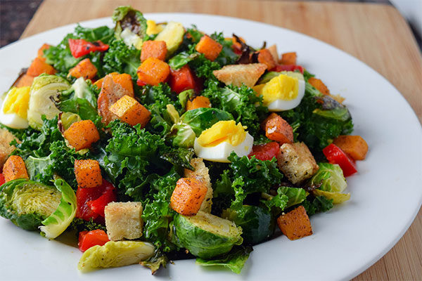 Kale Salad with Butternut Squash, Brussel Sprouts, and Roasted Red Pepper